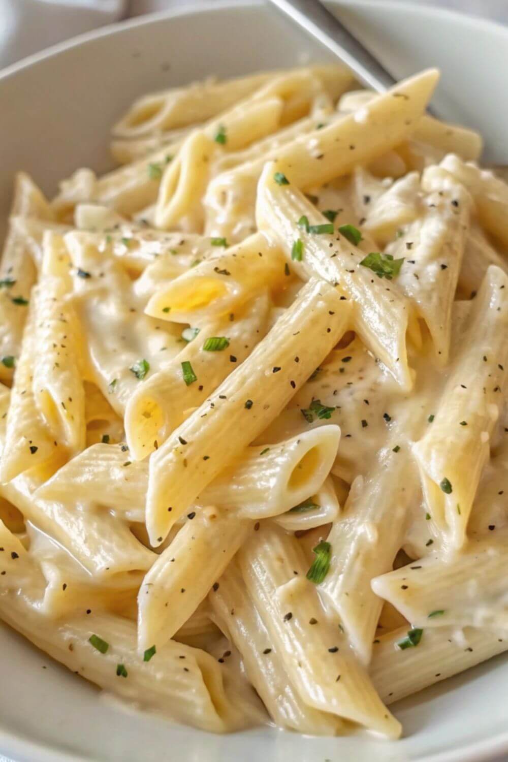 Penne pasta in a garlic sauce.