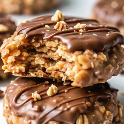 Half eaten cookie stacked on a cookie.