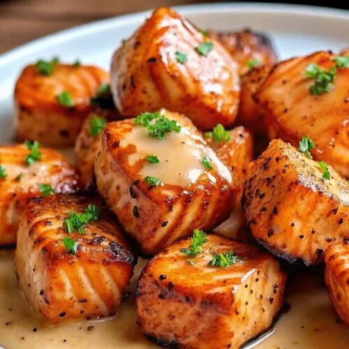 A plate of crispy salmon bites with bang bang sauce.