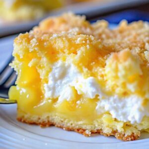 Slice of lemon cream cheese dump cake.