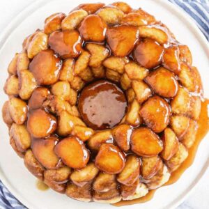 Monkey bread covered in a sweet gooey sauce.